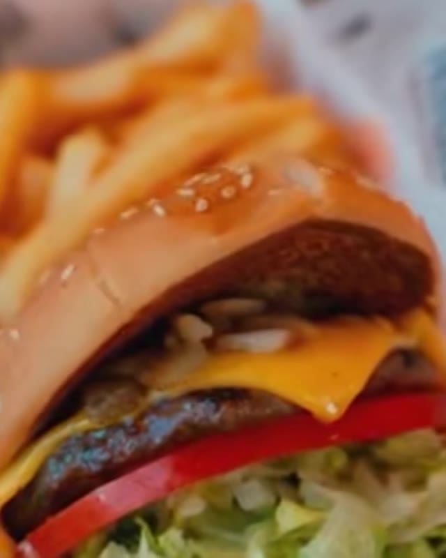 Close-up of a Habit burger and fries from the campaign film