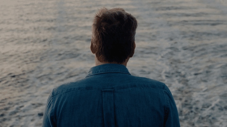 Doug Aitken looking out across the ocean